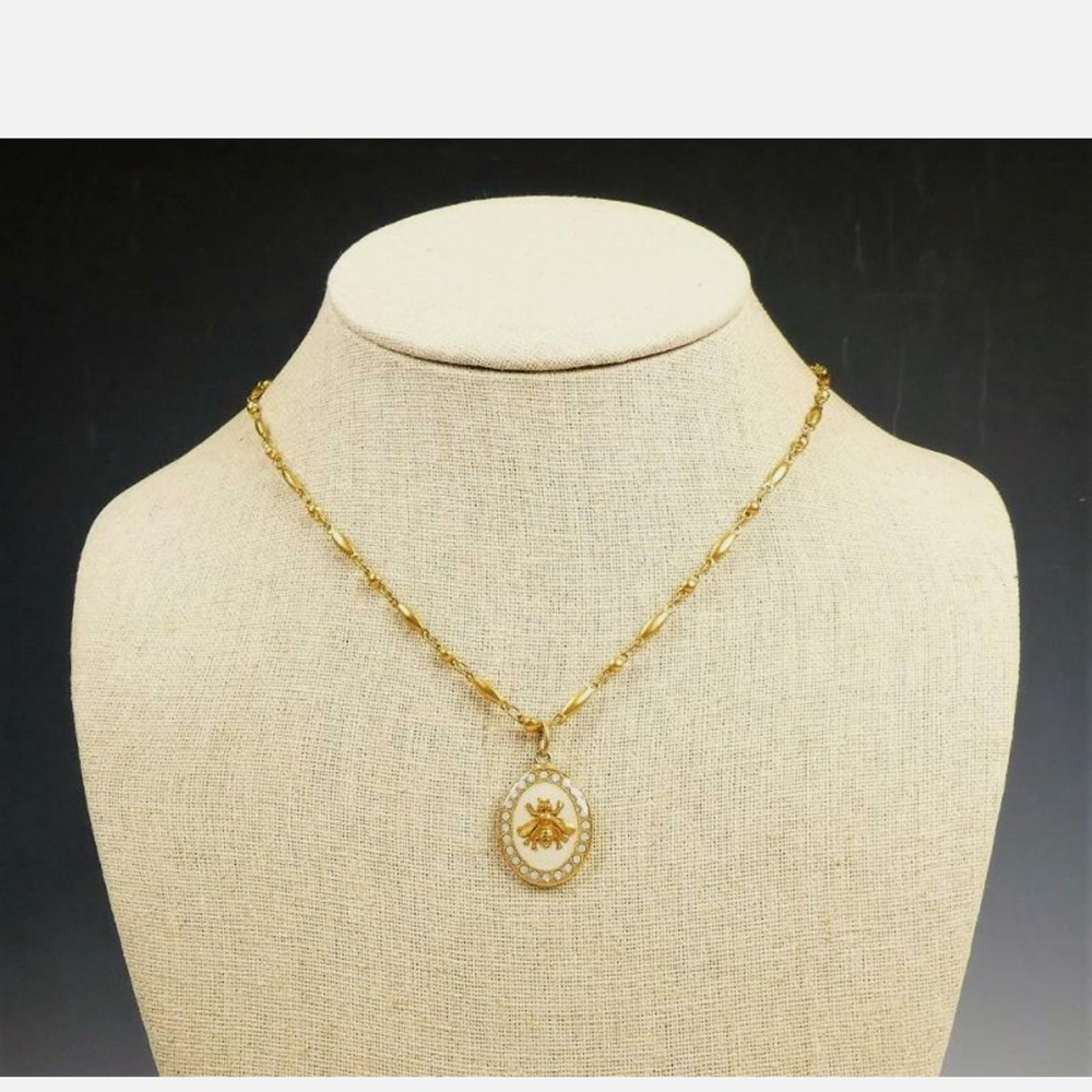 Catherine Popesco Gold Bee Pendant Necklace w/gray crystals around the pendant